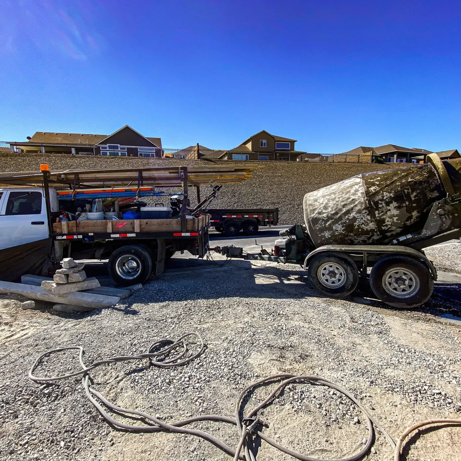 H&N Concrete work truck and portable mixer trailer on a jobsite
