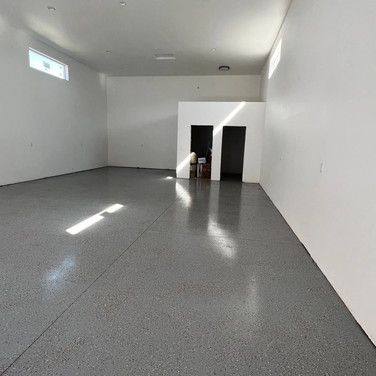 Finished shop interior with a smooth sealed concrete floor