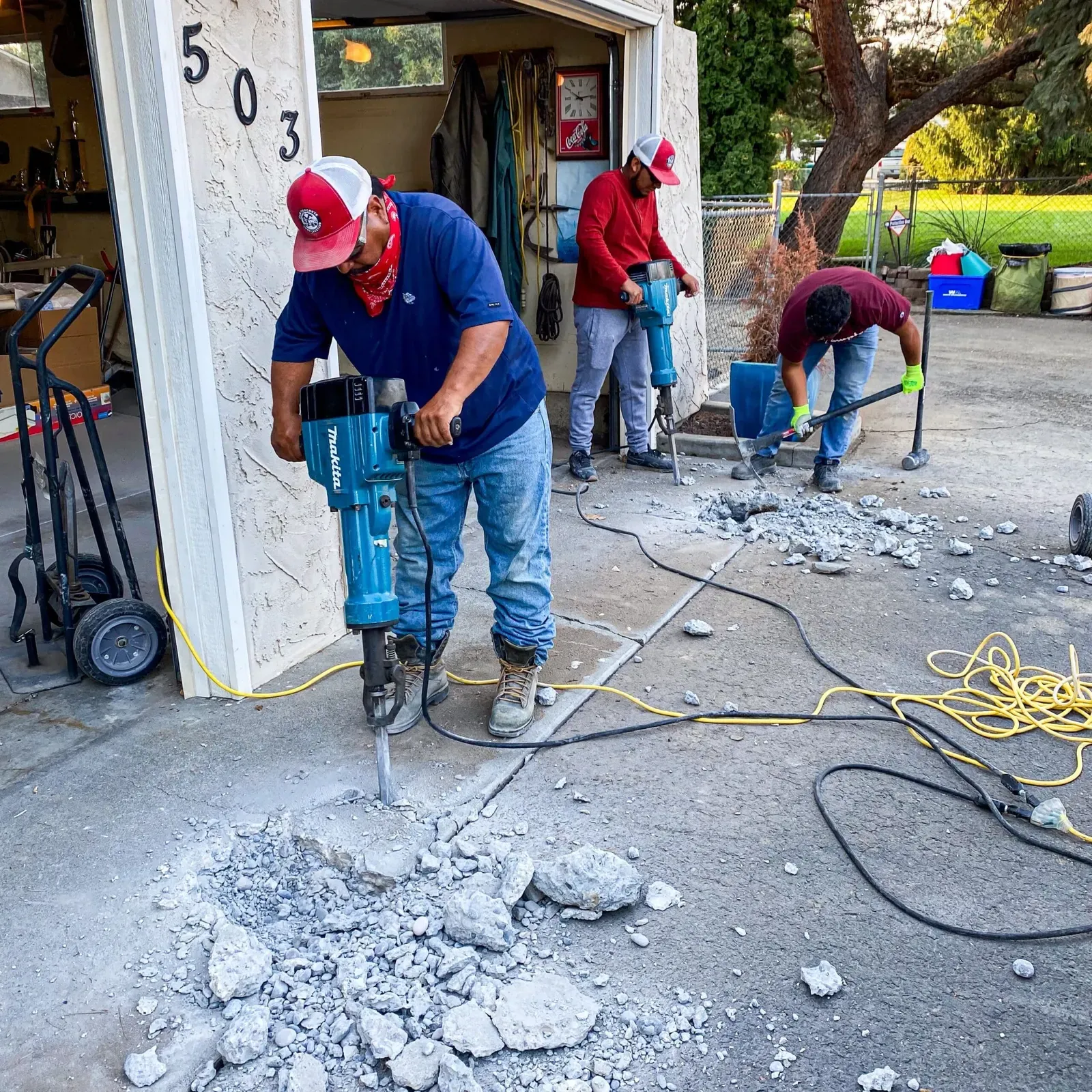 H&N crew breaking out old concrete with jackhammers for a replacement pour