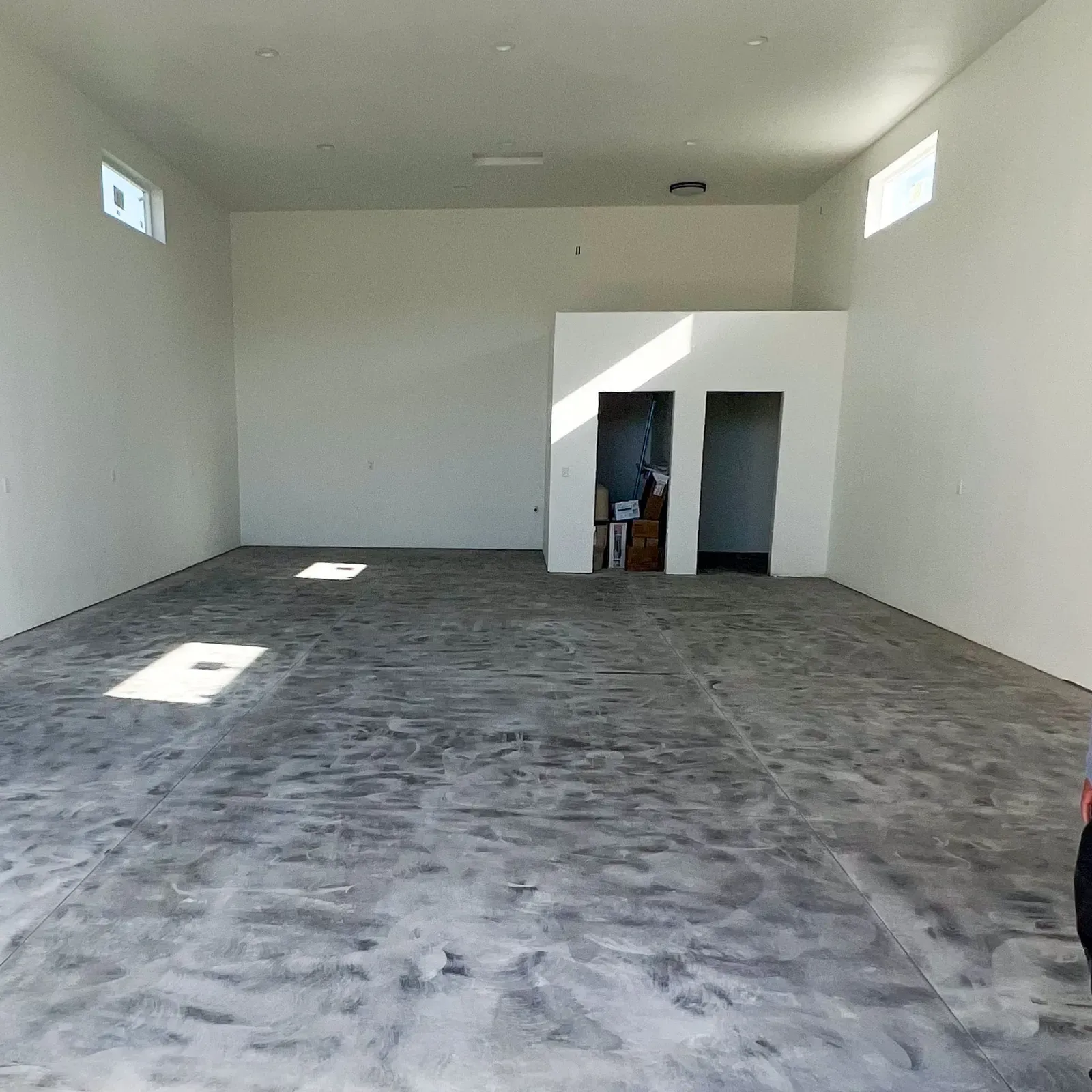 Shop interior slab freshly troweled and curing