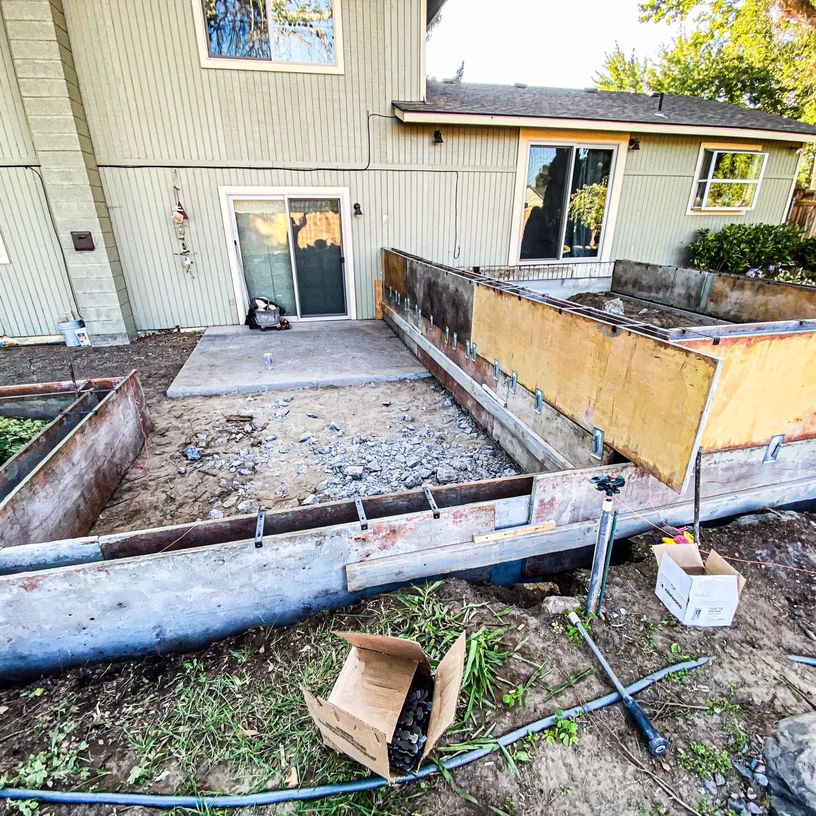 Forms set around an old porch planter during a repair rebuild